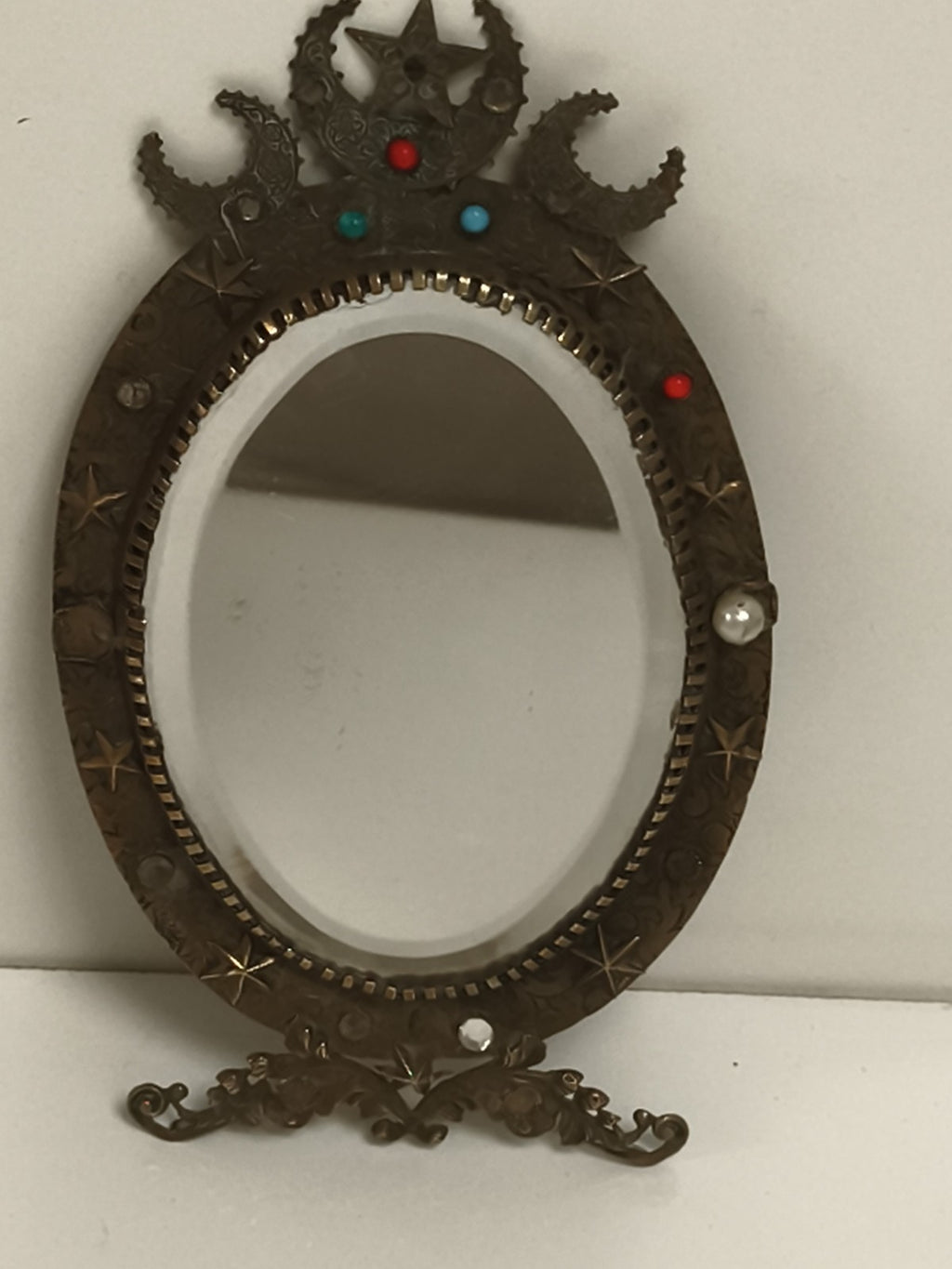 Miroir ancien ovale style Napoléon III, décor astres, pierreries, support métal
