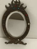 Miroir ancien ovale style Napoléon III, décor astres, pierreries, support métal