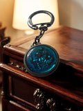 Porte-clés publicitaire vintage bleu médaillon rond – objet rétro années 70