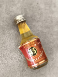 Miniature liqueur 43 Quarante Trois partiellement remplie étiquette rouge