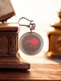 Porte-clés publicitaire vintage kiwi rouge rond ancien rétro