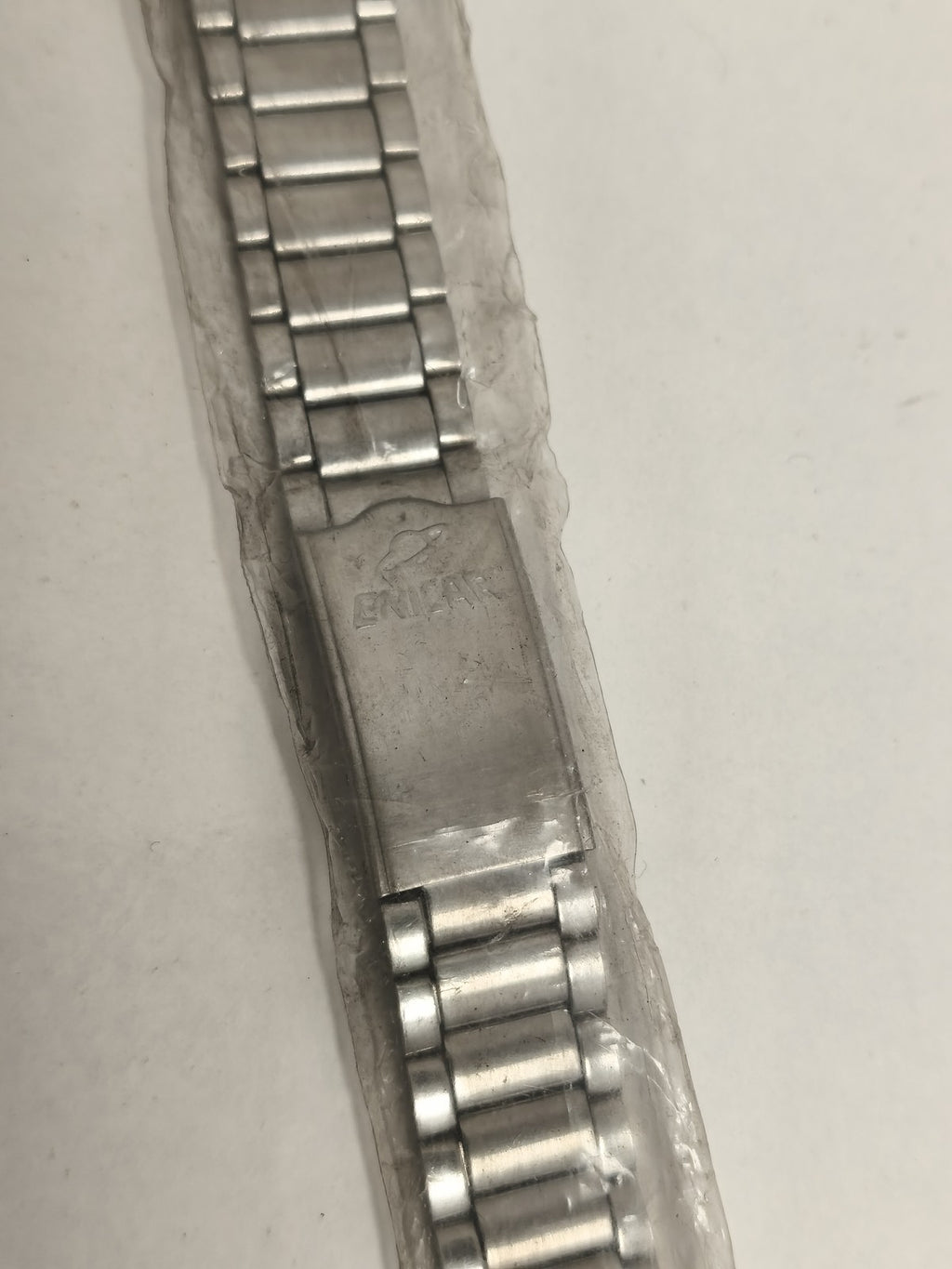 Bracelet montre Enicar vintage, finition métallique, maillons extensibles, ancie