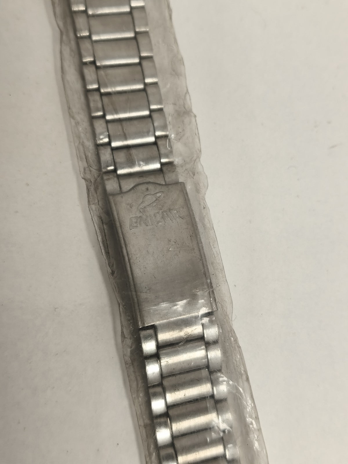 Bracelet montre Enicar vintage, finition métallique, maillons extensibles, ancie