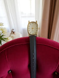 Montre femme vintage quartz ovale dorée bracelet noir rétro élégant non testée