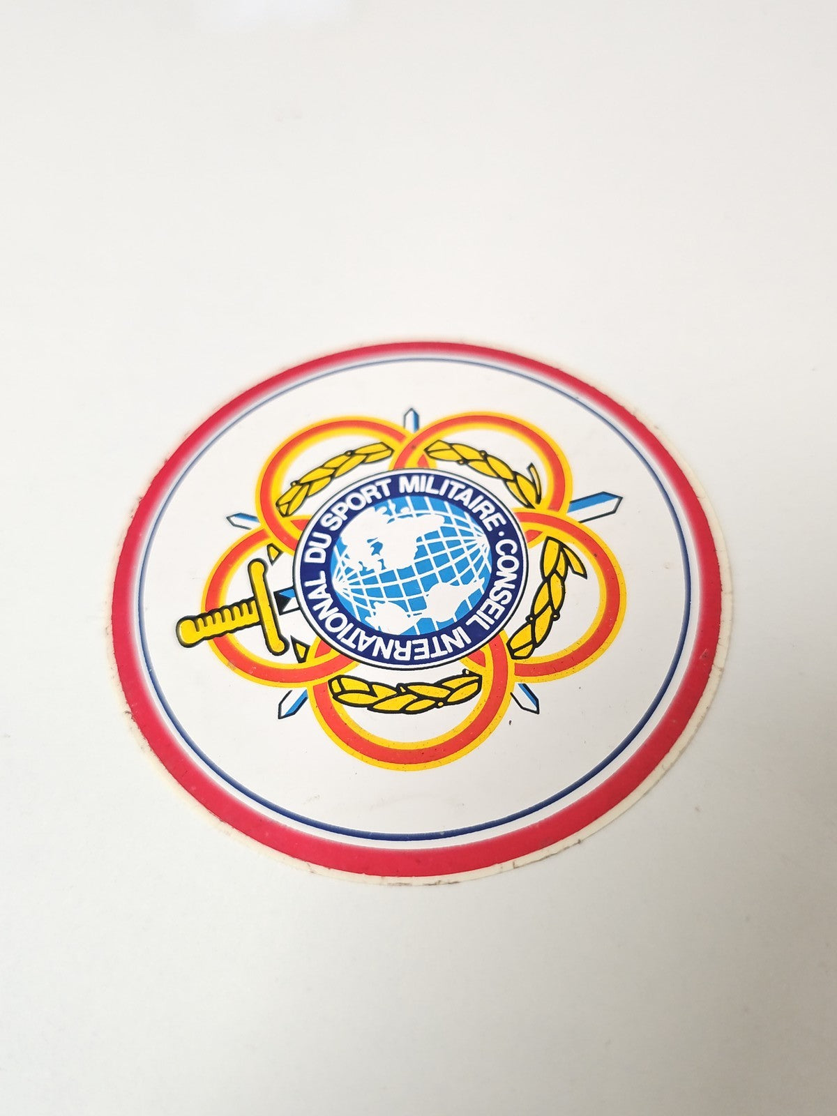 Vintage autocollant publicitaire ancien Conseil International du Sport Militaire