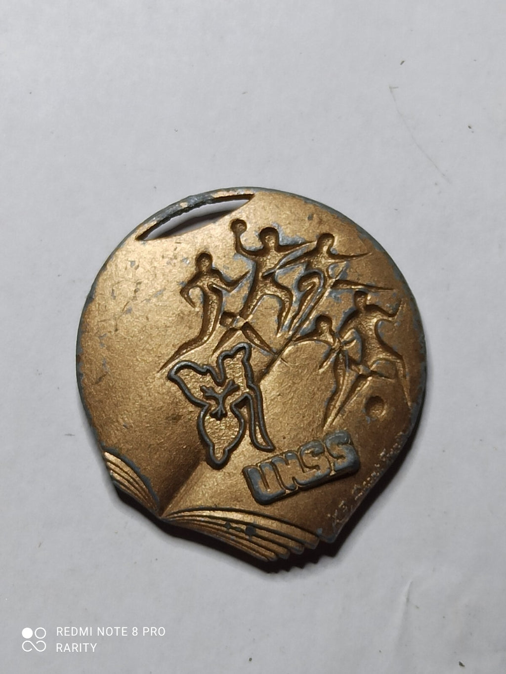 Médaille ancienne UNSS blason bronze aspect patiné sport scolaire UKSS