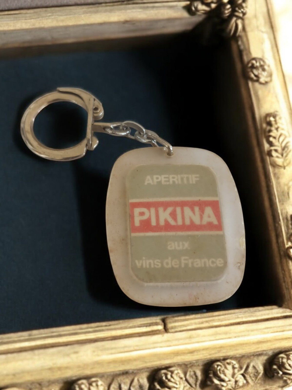 Porte-clés publicitaire vintage PIKINA apéritif France années 60 rétro alcool