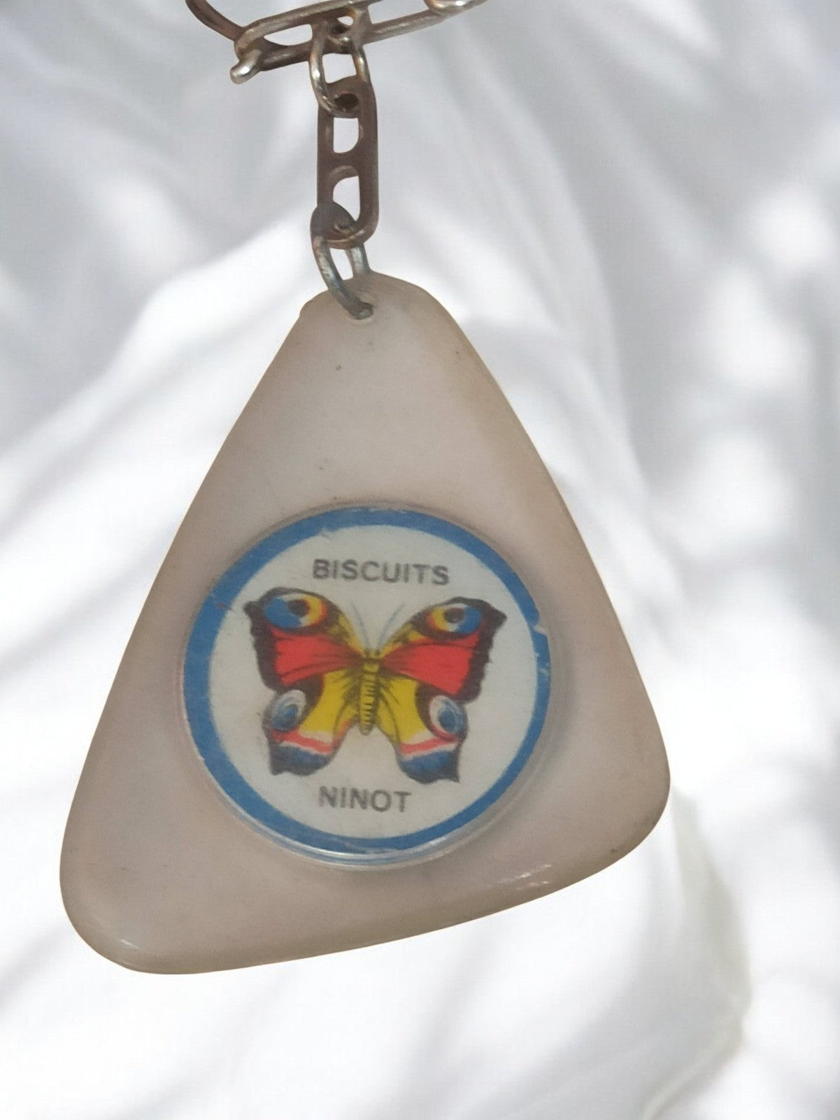 Porte-clés ancien Biscuits Ninot papillon triangle rétro vintage publicité