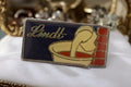 Pin's vintage Lindt années 80 logo émaillé chocolat publicité rare