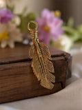 Pendentif plume vintage métal doré années 50 bijou rétro deadstock