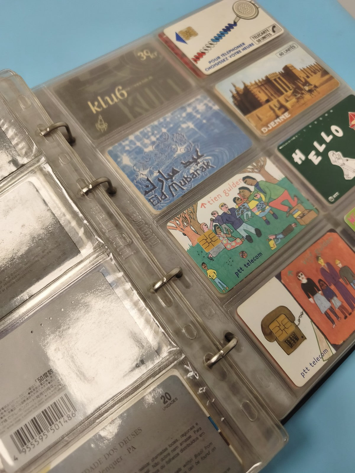 Vintage multi-coloured foreign phone card album collection