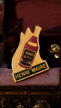 Pin's vintage Henri Maire bouteille vin RAID JURA M. BLANC ancien badge rare