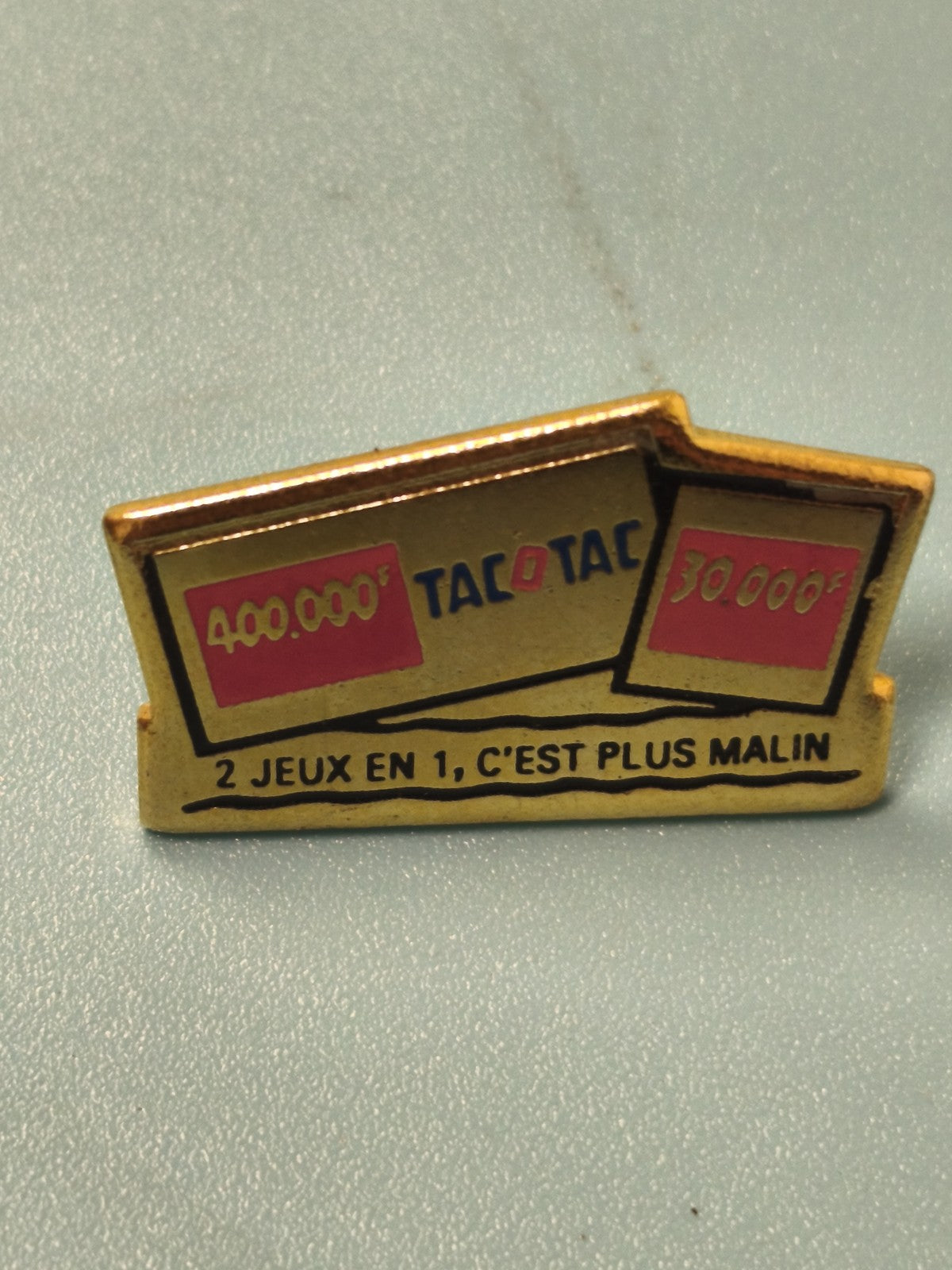 Pin's vintage publicitaire Tacotac 2 jeux en 1, collection, doré, ancien