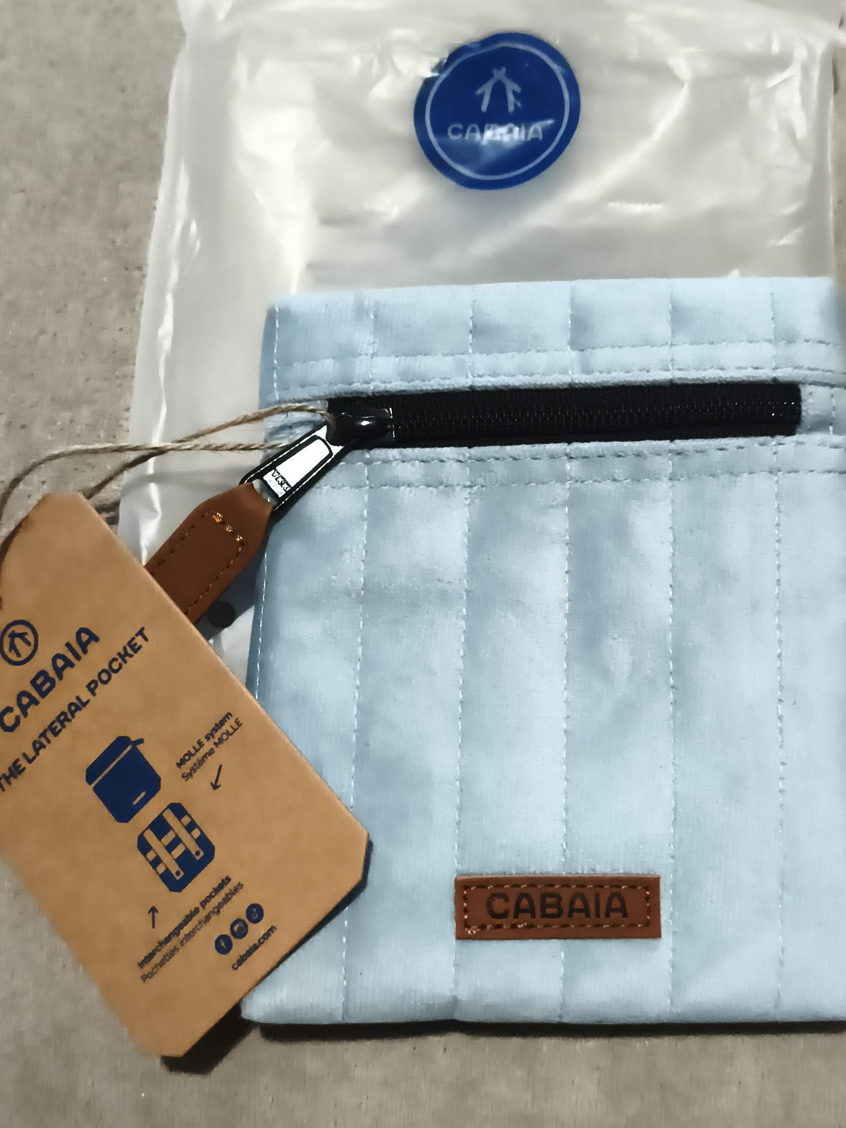 Pochette latérale Cabaia bleu clair neuve 15 cm zip, accessoire sac