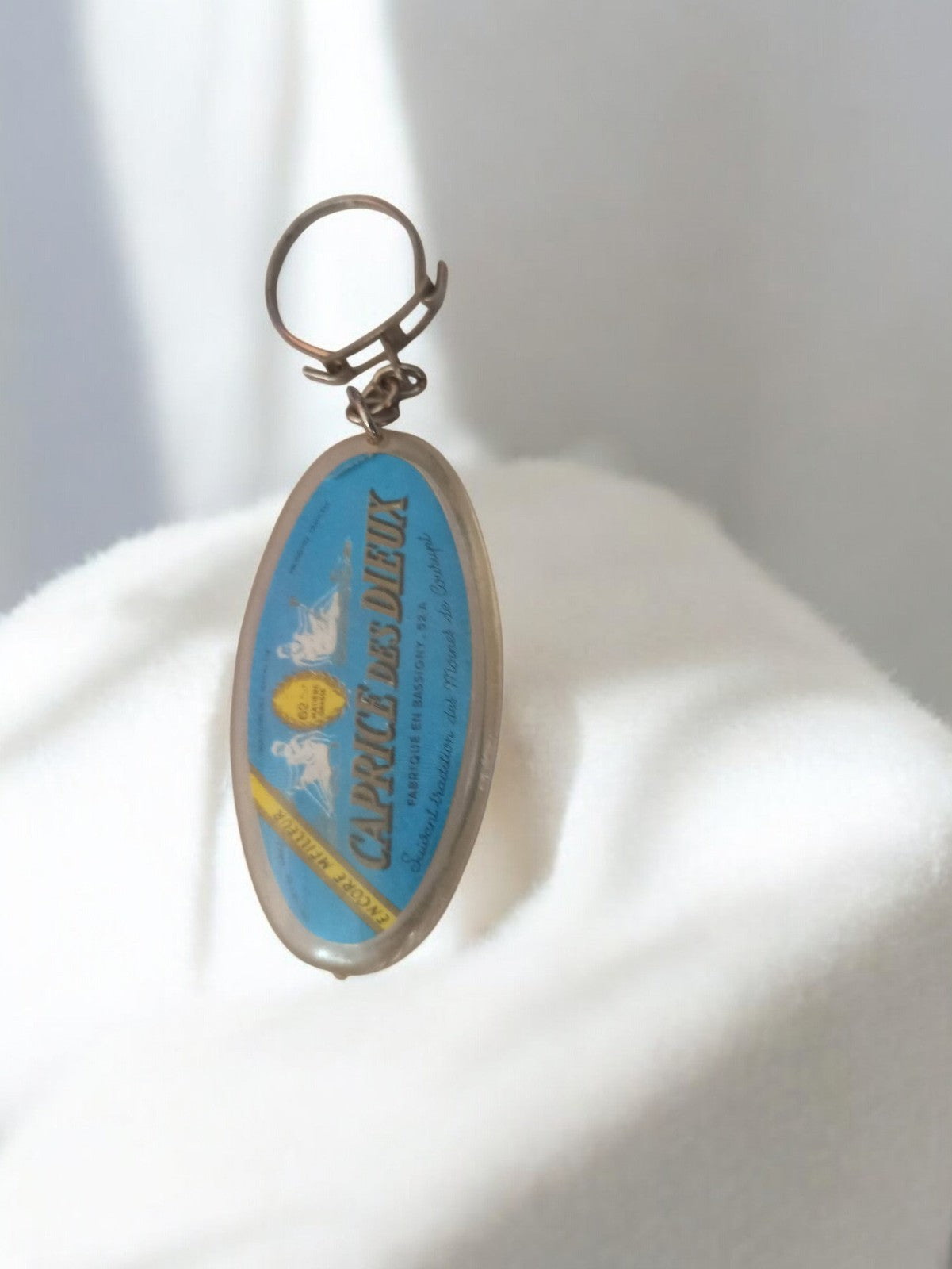 Porte-clés ancien Caprice des Dieux vintage rétro bleu publicitaire rare