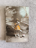 Carte postale ancienne Heureuses Pâques fillette colorisée CPA