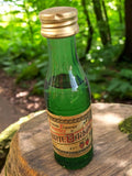 Mignonette liqueur Sainte Baume vintage, bouteille verre vert, étiquette d'époqu