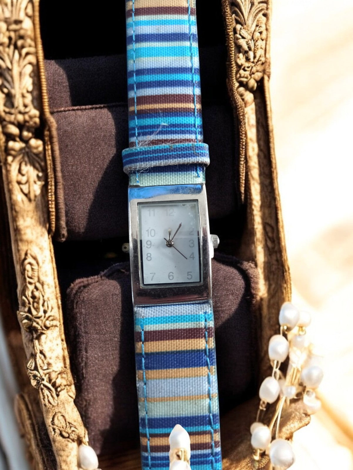 Montre femme vintage Yves Rocher cadran rectangulaire bracelet rayé bleu marron