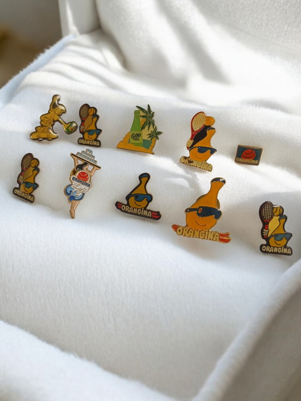 Lot 10 pin's Orangina vintage rétro années 80, publicitaires, mascottes