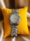 Montre homme Laurens vintage, bracelet acier, cadran blanc, non testée