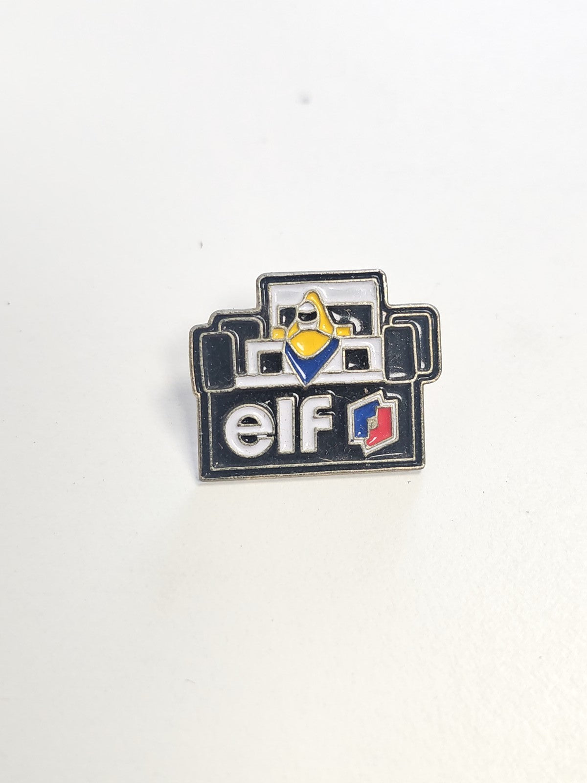 Pin's ancien ELF vintage, badge rétro collection automobile, objet publicitaire