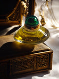 Miniature parfum vintage Volupté flacon rare forme galet vert doré