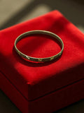 Bracelet jonc vintage doré, motif gravé étoile, bijou rétro ancien métal