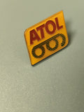 Vintage pin's ATOL jaune rouge logo rétro opticien collection (Ref 14)