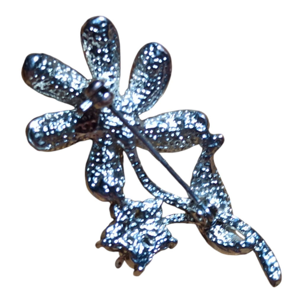 Broche fleur vintage argentée Art Déco strass violets perle centrale