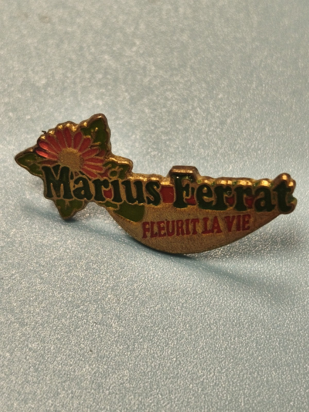 Pin's vintage Marius Ferrat fleur, slogan "Fleurit la vie", collection (Ref 17)