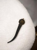 Montre femme vintage octogonale noire à remonter, cadran signé, rétro années 70