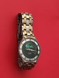 Montre Lacoste quartz gris doré cadran logo crocodile pile à changer