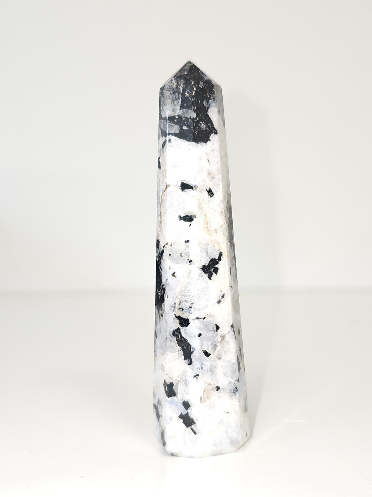 Vintage decorative obelisk in old natural stone, collectible figurine