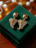 Paire boucles d’oreilles vintage rétro pendentif feuille dorée