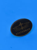 Vintage pin's Statesman ovale noir doré, collection badge ancien rare