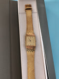 Montre femme vintage Edma mécanique ancienne, plaque or 18k, élégance rétro