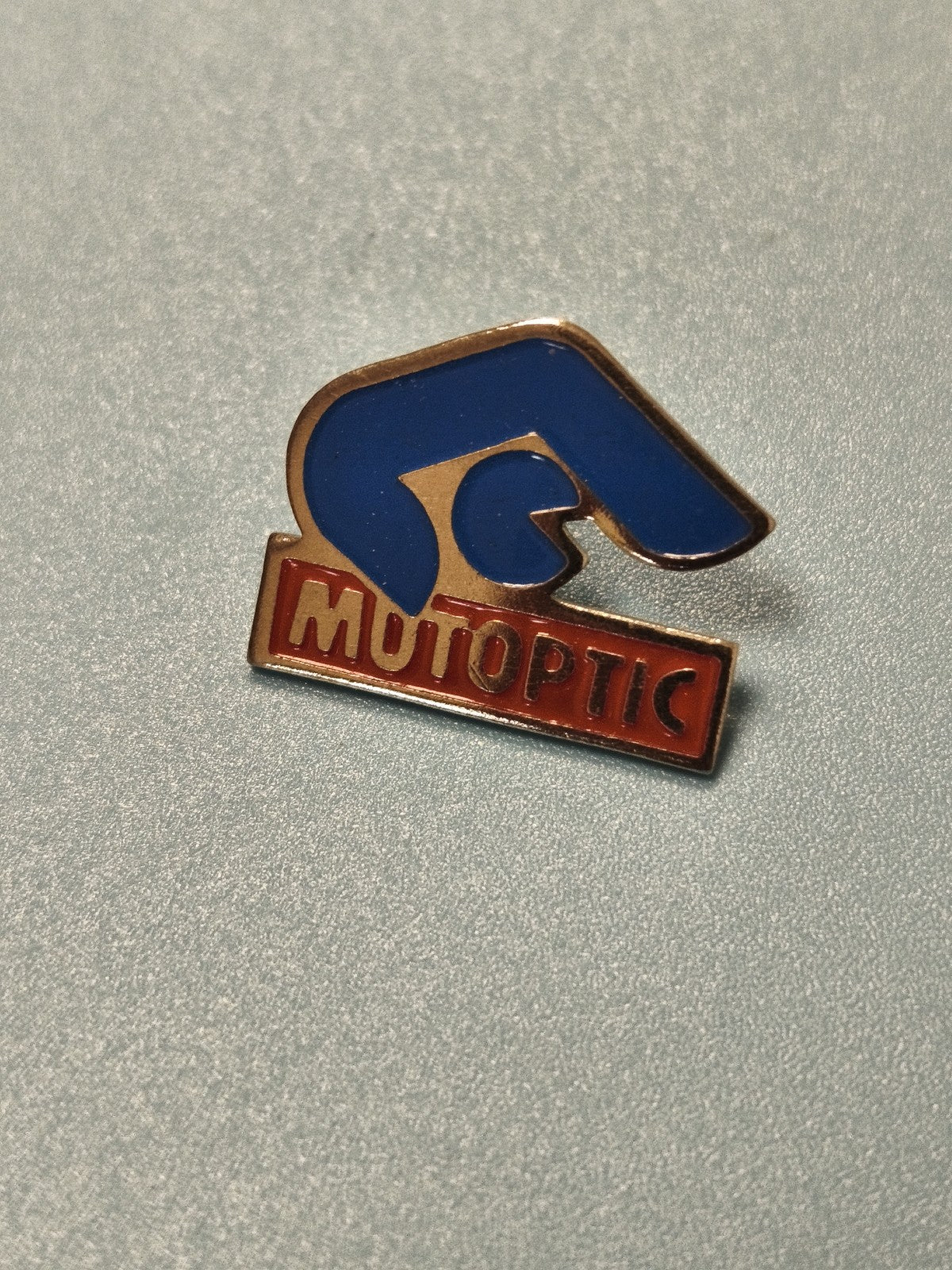Vintage pin's Mutoptic bleu rouge main publicitaire collection (Ref 14)