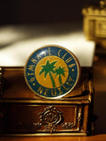 Pin's vintage Gymnase Club Neuilly rond émaillé bleu vert jaune badge
