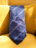 Cravate homme vintage Trussardi bleu motif géométrique élégante rétro