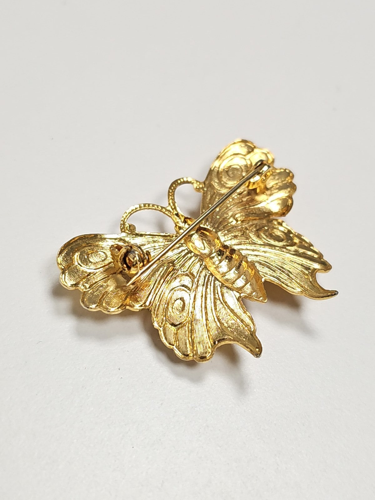Vintage antique gold-tone metal brooch, decorative collectible jewelry