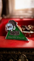 Pin's vintage Marius Ferrat triangle vert années 80-90 mascotte rétro