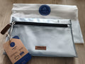 Pochette Cabaia argentée neuve 24 cm zip devant, trousse accessoire