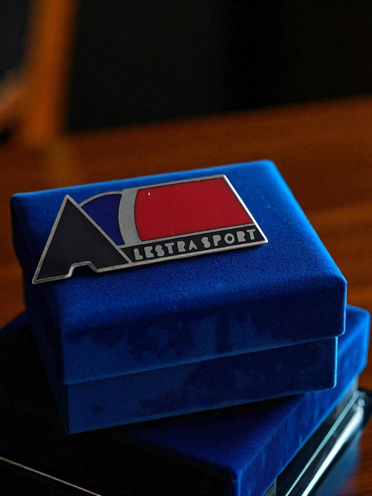 Vintage promotional Lestra Sport enamel pin, tricolor retro decorative accessory