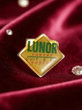 Pin's publicitaire vintage Lunor saveur badge rétro années 90 jaune vert