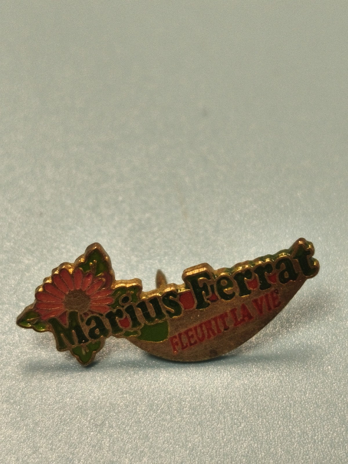 Vintage pin's Marius Ferrat fleur émaillée publicitaire collection