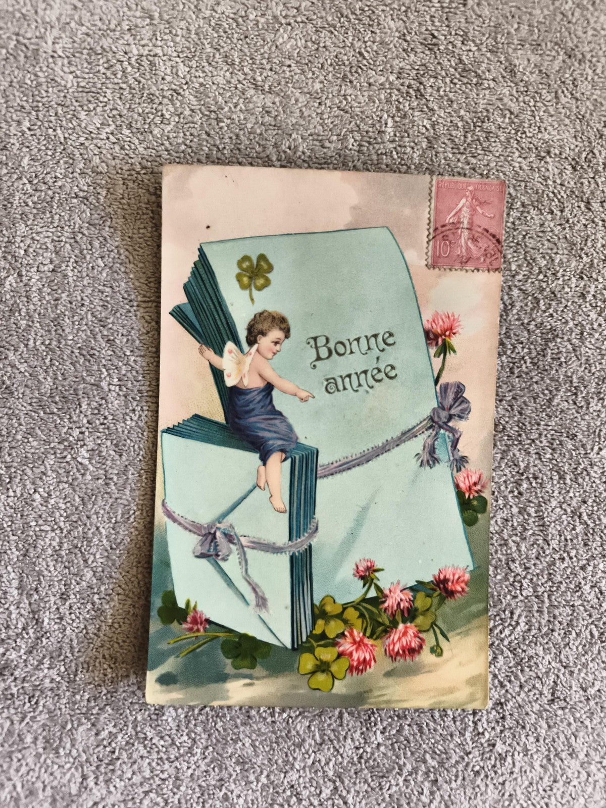 Carte postale illustrée Bonne année CPA ange trèfle fleurs timbre 10c France