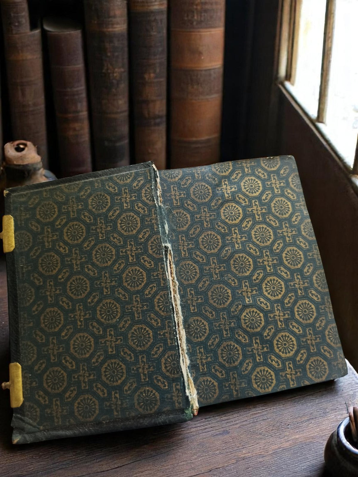 Vintage religious ancient missal in black gilt leather binding with floral decoration