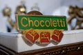 Pin's publicitaire Chocoletti vintage rétro années 80 vert rouge doré badge