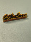 Vintage pin's publicitaire Le Merlan 60 boutiques passionnément jaune noir (Ref