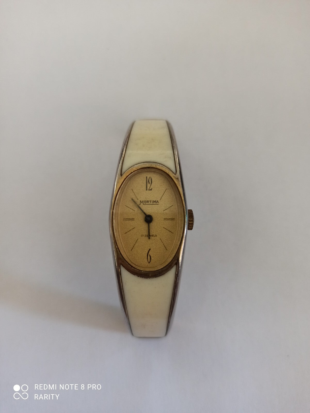Montre vintage femme Mortima ovale cadran doré bracelet blanc rétro